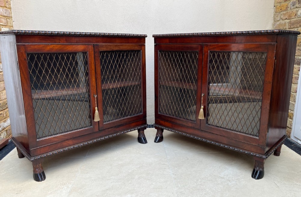 a pair of regency mahogany cabinets